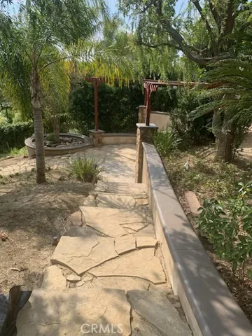 Terraced backyard. Meandering trail is accented with stone