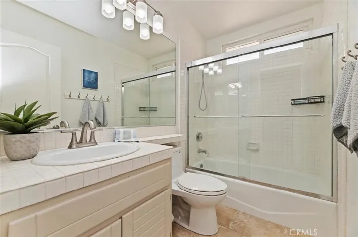 Freshly painted 2nd bathroom. Combo tub and shower, ceramic tile flooring and updated lighting