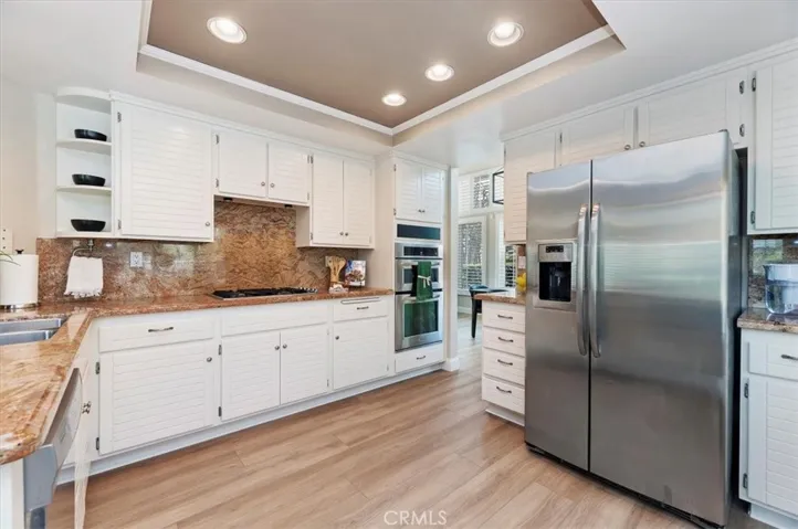Another view of kitchen taken from Breakfast nook area. Lots of cabinetry and counter space