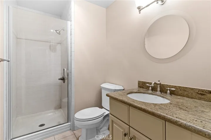 Downstairs bathroom with glass door shower