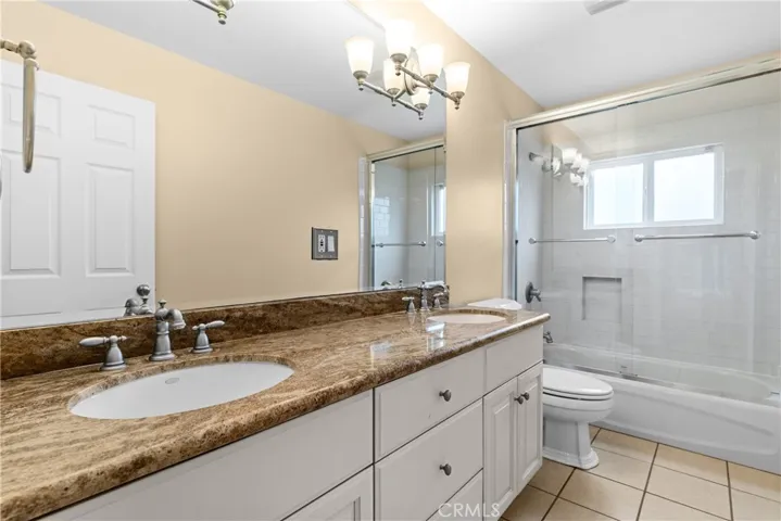 Upstairs hallway bathroom with double vanity