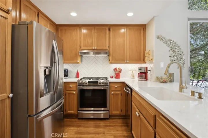 The newer gas range, stainless refrigerator and high quality vent hood all remain.