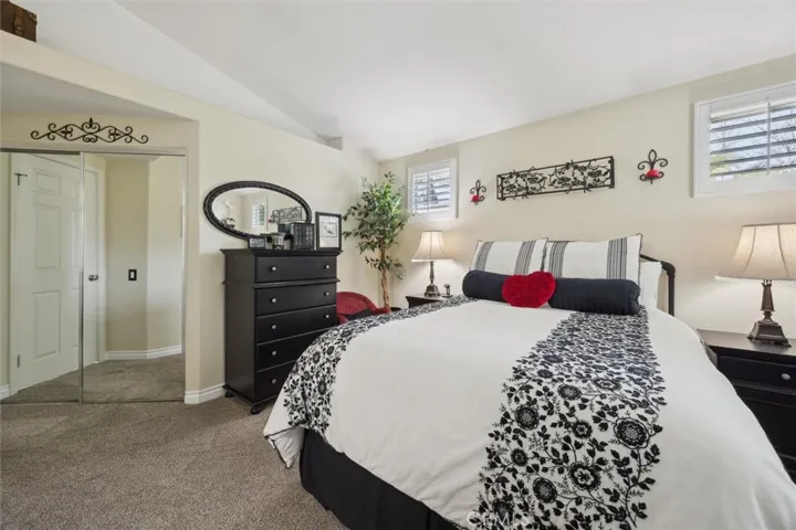 The closet features mirrored doors.