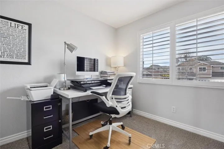 Natural light pours through the picture window.