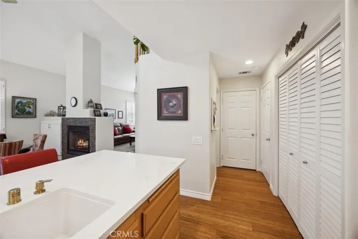 Conveniently located behind the louvered doors is the laundry area.