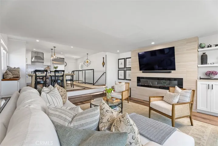 Contemporary finishes with an elegant gas fireplace.