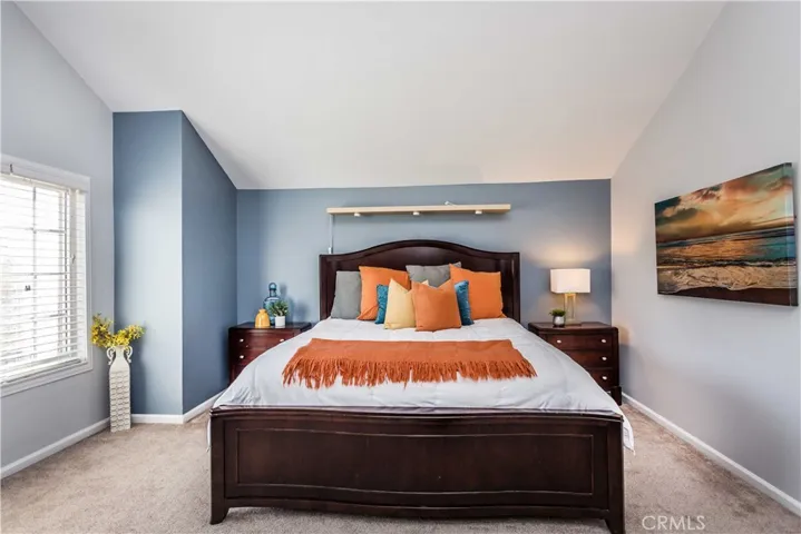 Primary suite with vaulted ceilings