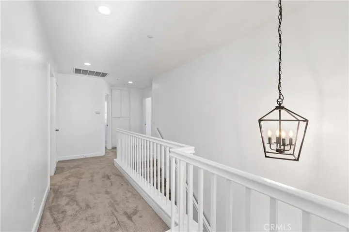 Hallway with Linen Closet and Utility Closet