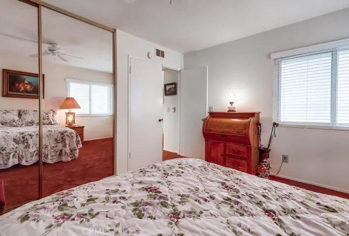 Bedroom 3 with mirrored closet doors