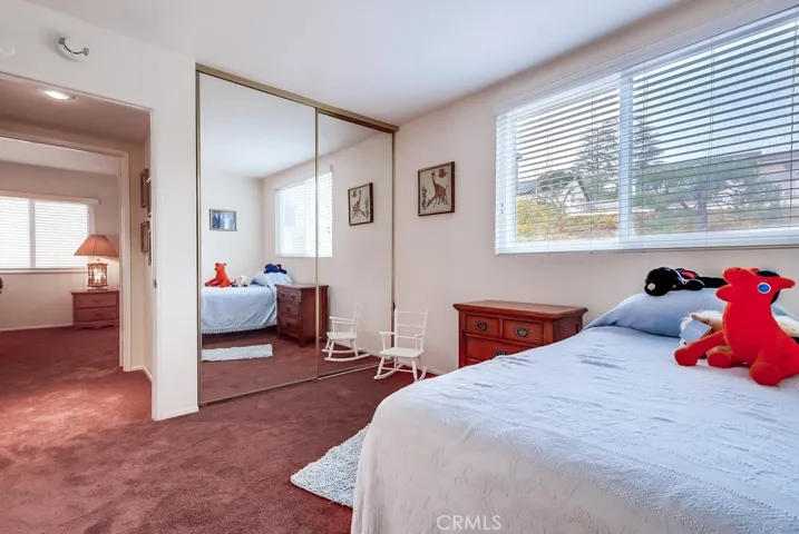 Bedroom 2 with mirrored closet doors