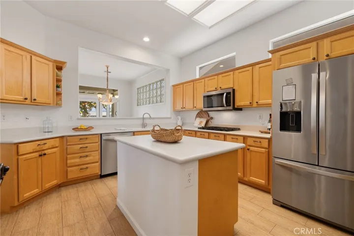 Open Kitchen with Stainless steel appliances.