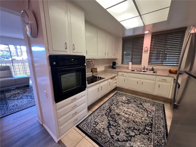 New stainless refrigerator and dishwasher.  Microwave included - not in picture.