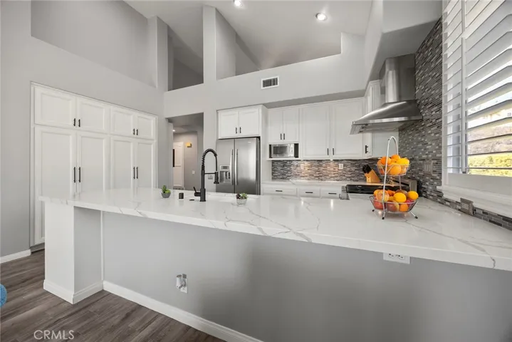 Kitchen counertop with seating. Large pantry.