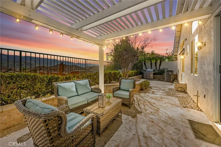 Backyard entertaining area and beautiful views. Twilight conversion photo.