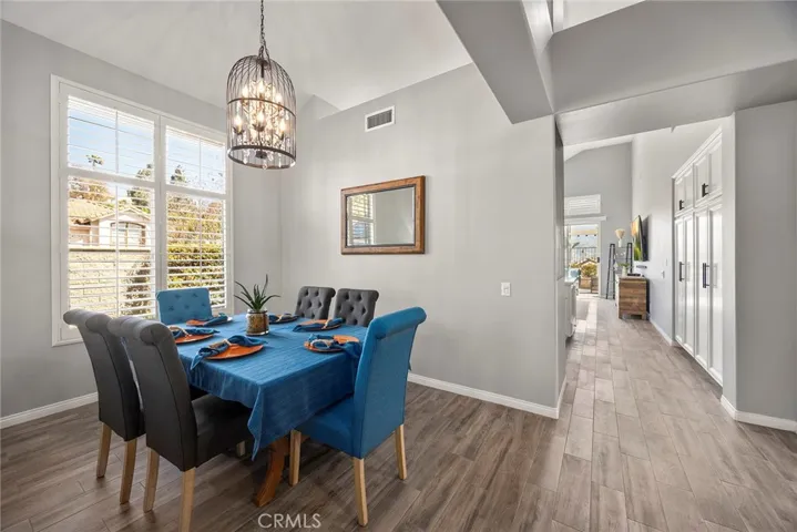 Open Dining Room with pretty chandelier.