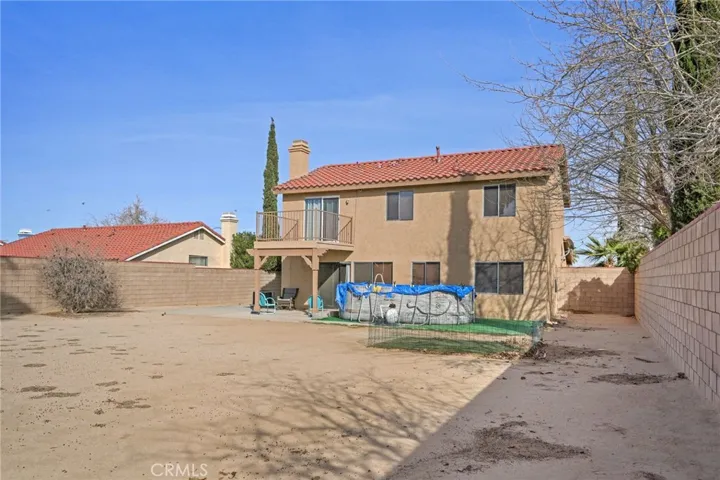 Backyard offer 8,678 square feet, above ground pool.  Perfect for family gatherings/parties, custom BBQ and/or In ground pool