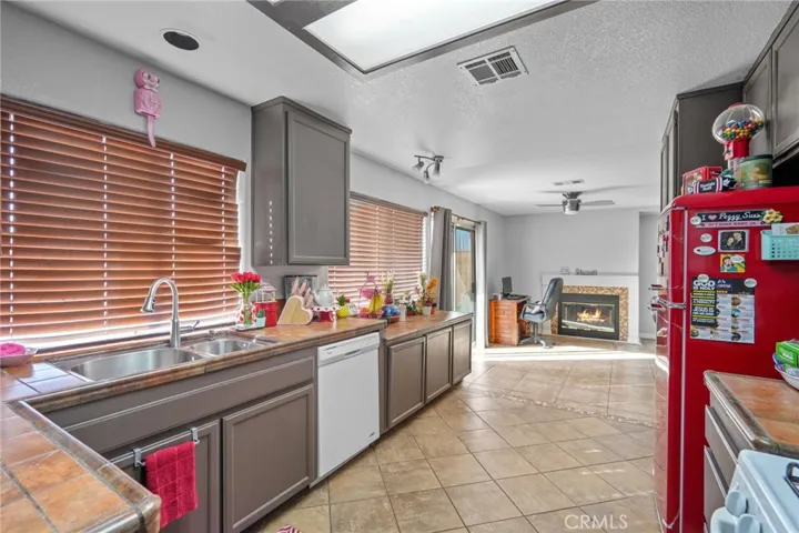 Kitchen with custom tile counters and over looking the backyard