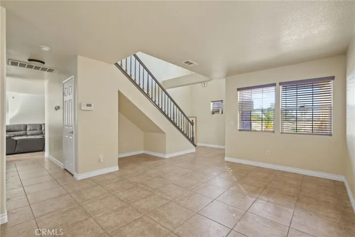 Formal living room overseeing access to the 2nd living room/family room or can be a formal dining room