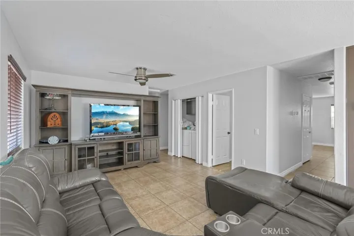 Downstairs:  the doors at the right take you to the full bathroom, laundry closet, janitor room, 1 bedroom & direct garage access