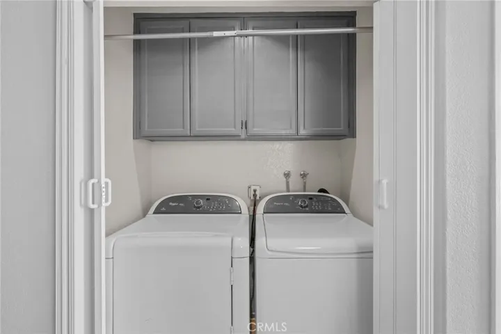 Downstairs: Laundry closet with storage space.  There is a janitor closet to the left of this closet