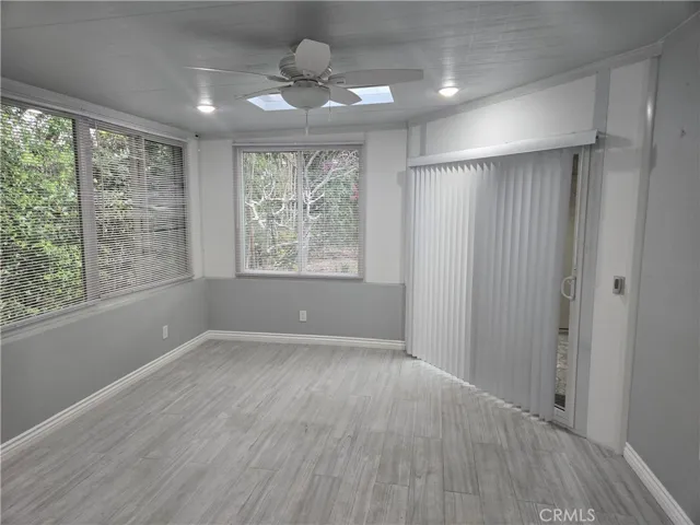 Light/bright sunroom with canned lights, & fan with its own light