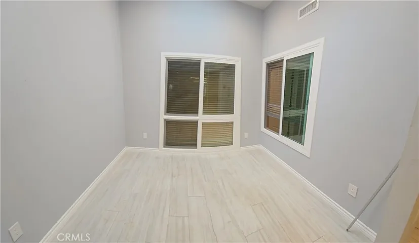 Sliding doors and window in enclosed atrium...note the light/bright look