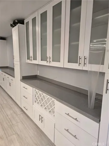 Plenty of quality built-ins along walls of living/dining rooms