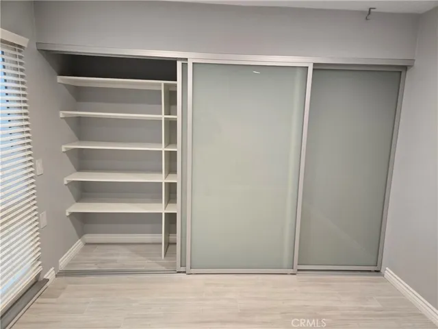 guest bedroom closets with opaque glass inserts