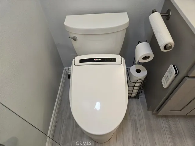Classy "Lotus" commode upgrade in master bath