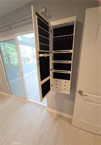 Custom jewelry/knicknack rack leading to Sunroom from Master