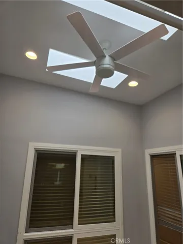 Enclosed atrium w/skylights that open and canned lights to make it a bright and functional room addition