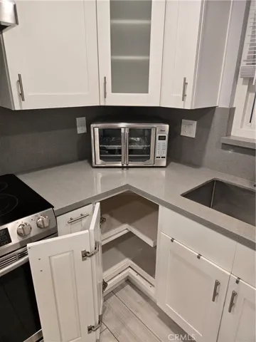 Kitchen built-ins with self-closing drawers