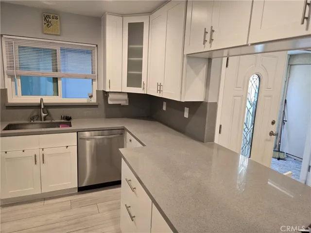 Gourmet kitchen with expanded quartz countertops, high quality appliances and new cabinets (NOT just cabinet doors)