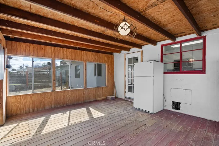 Enclosed patio - refrigerator included.
