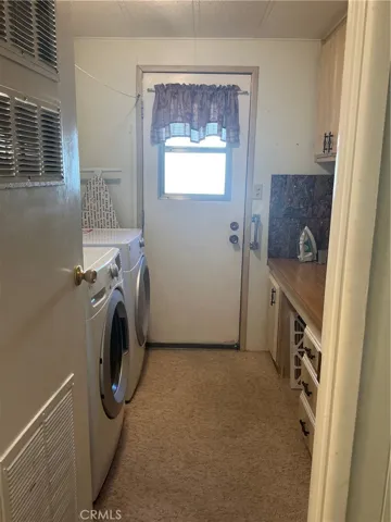Laundry room, exterior door to side yard.