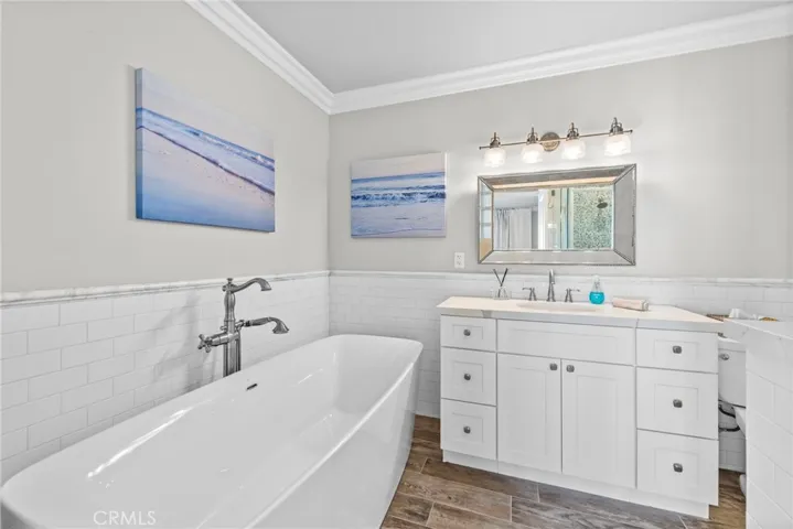 Ensuite bath with vanity and full-size tub