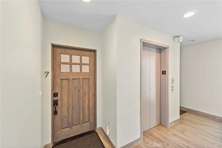 Front door conveniently located right next to elevator down to ground level and parking garage.