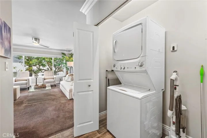In-unit laundry located in entry hallway