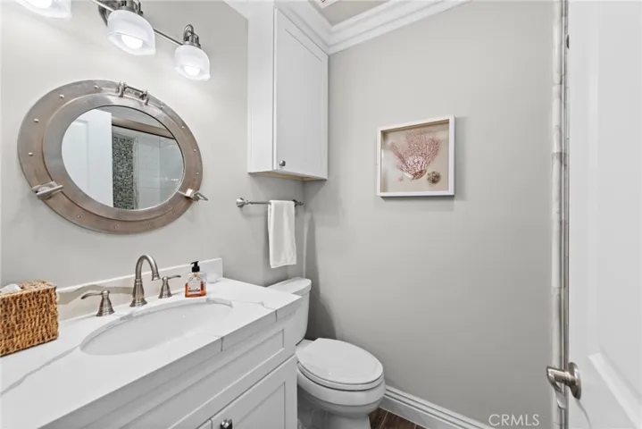 Powder bathroom off entry hallway with shower