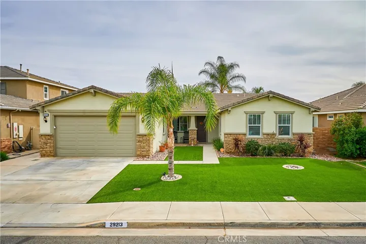 Low maintenance landscaping.  Artificial lawn in front and backyards.