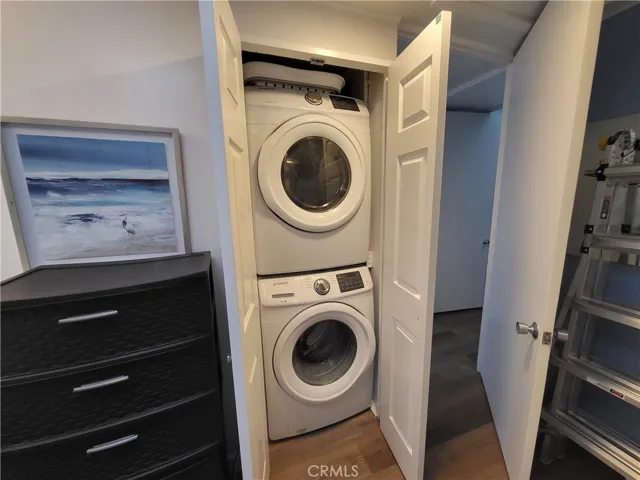 Washer/Drying in closet in the bathroom.