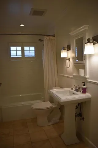 Full bathroom with shower over tub