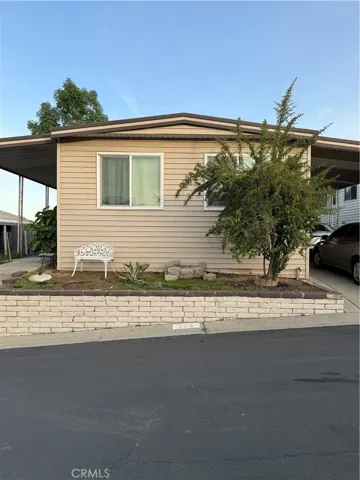 Front view, long driveway on the right