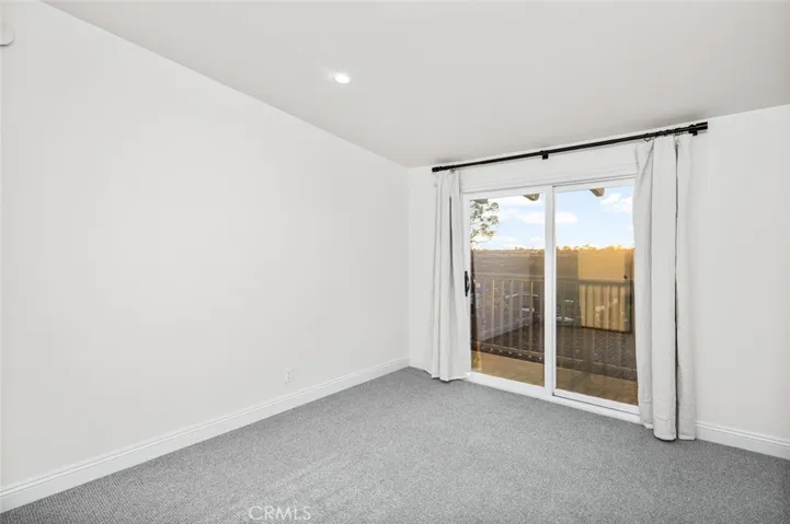 Secondary bedroom with balcony to capture the views.