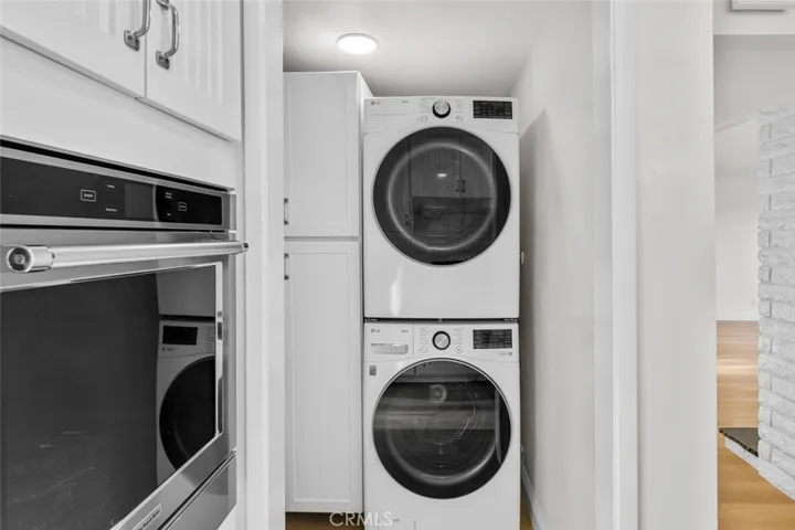 New washer and dryer are provided in a separate room off the kitchen.