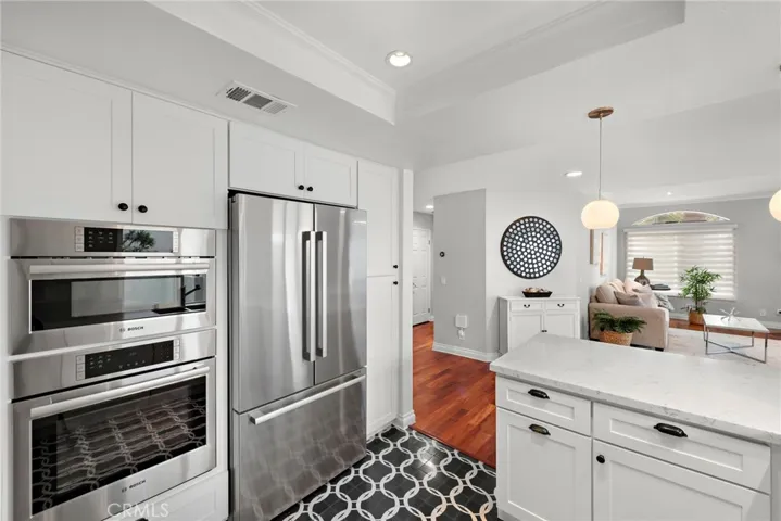 Bosch and Thermador stainless appliances, quartz counters, designer tile floor