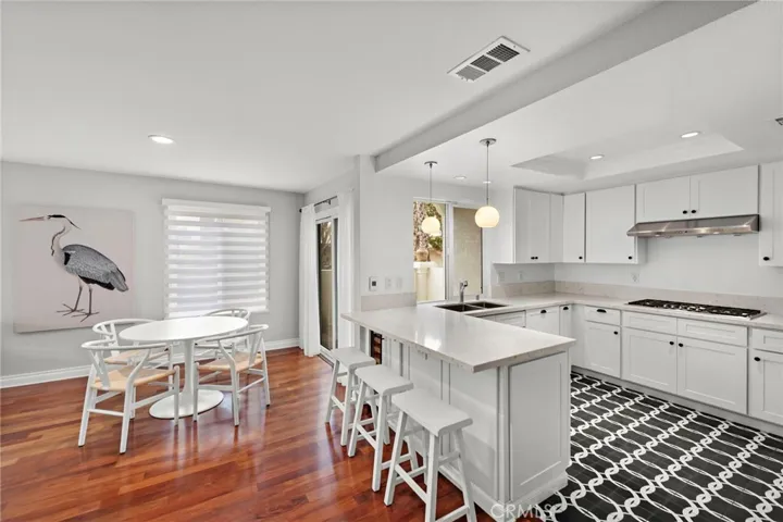 Chef's kitchen with under counter wine fridge in island.