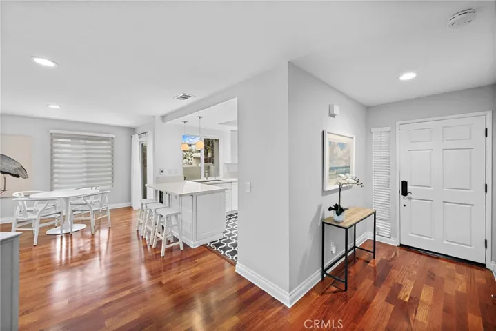 Peek view of dining area and kitchen