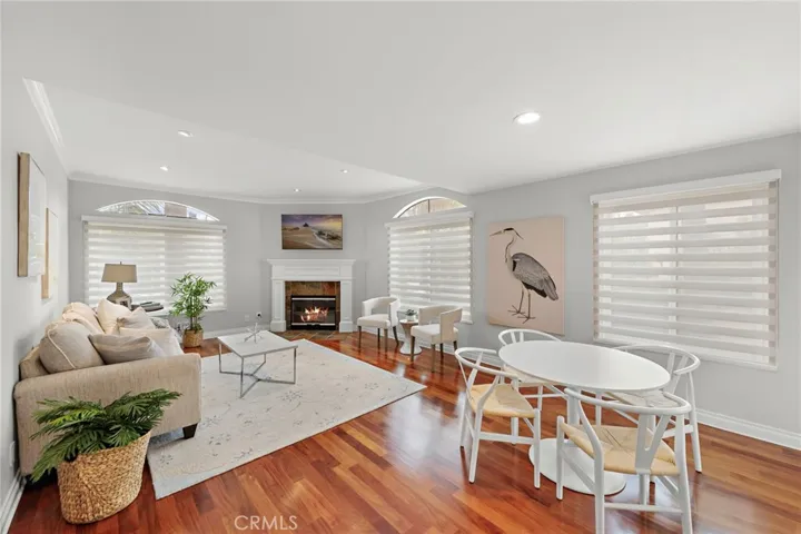 Open floorplan - dining area, living room with cozy fireplace, Brazilian Mahogany hardwood floors