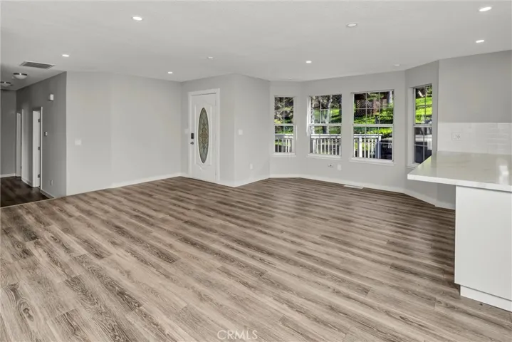To the left is the hallway leading to bedrooms.
